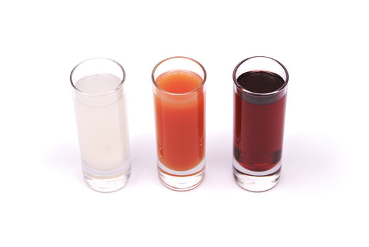 Three glasses with juice and tonic