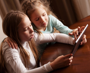 Children playing on tablet