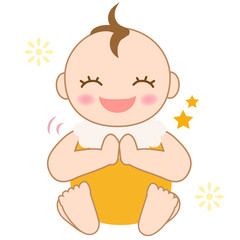 笑顔で拍手する赤ちゃん