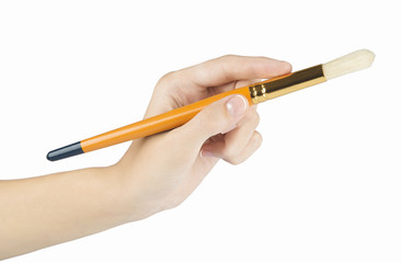 woman paints a picture with a brush