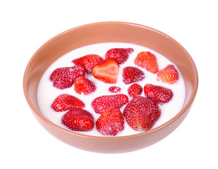 Strawberry with milk in a ceramic plate