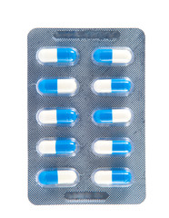 Obraz premium White and blue capsule in transparent blister pack