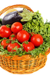 Fresh vegetables with water drops in basket