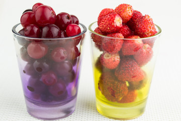 wild strawberry and cranberries in glass