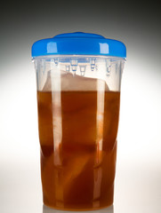Still Life of Frozen Beverage with Straw in Plastic Bottle