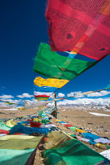 Prayer Flags and the range of Himalaya Mountains in in the backg