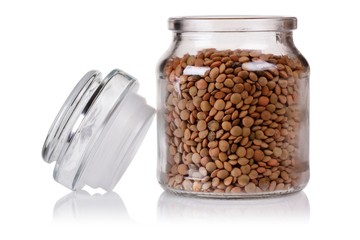 lentils in open jar. isolated on white background