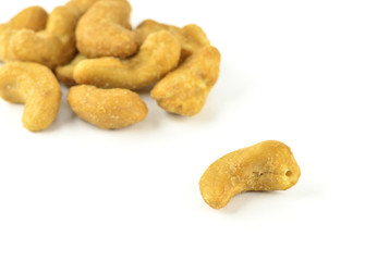 salted cashew nuts on white background