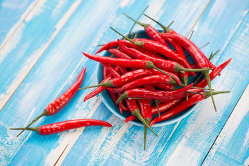 Red chili peppers on wooden boards, view from above
