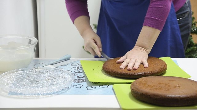 Housewife cutting the cake