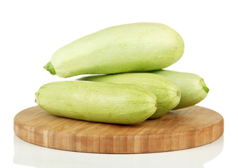 Fresh marrows on cutting board, isolated on white