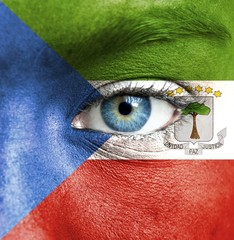 Human face painted with flag of Equatorial Guinea