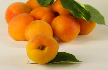 Apricots on wooden table