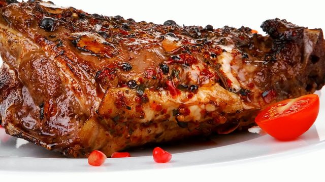 ribs served on plate with pomegranate beens 1920x1080 intro moti