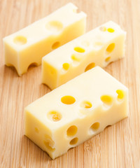 Emmental cheese tacos on wood
