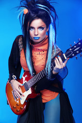 Fototapeta na wymiar Rock girl posing with electric guitar playing hard-rock isolated