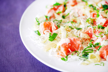 Salmon ceviche on fried vermicelli noodles, scallions and sesame