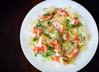 Fried crunchy rice noodles with salmon ceviche, sesame seeds
