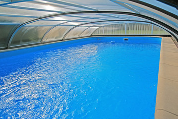 Swimming pool with a roof
