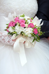 Wedding bouquet of roses with ribbons