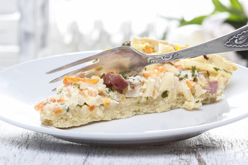 Piece of vegetable tart. Selective focus