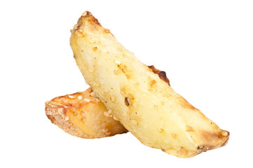Sliced baked potatoes with sesame over a white background