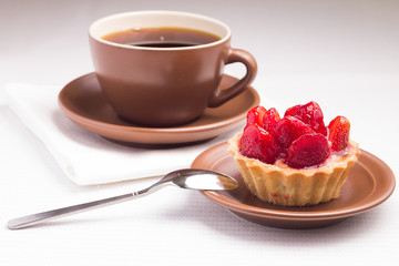 Strawberry dessert in Waffle Basket with Cup of Hot Tea