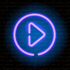 Neon music play button on brick wall, vector Eps10 illustration.