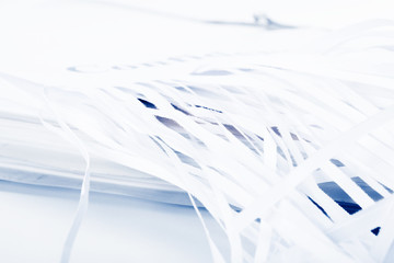 Shredded document with blue tone