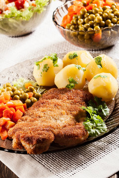 Breaded chop and potatoes