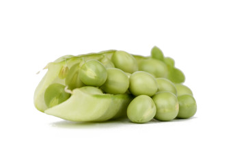 Pods of green peas with leaves on white background.