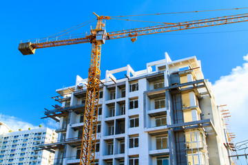Apartments construction site with yellow crane