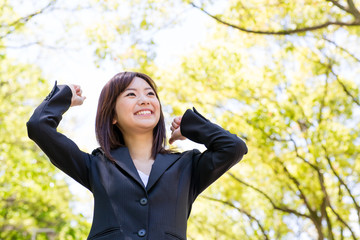 asian businesswoman relaxing in the park