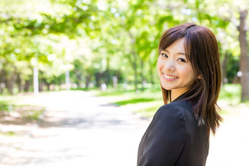 asian businesswoman in the park