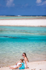 Mother and daughter on tropical beach