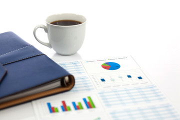 Business report with cup of coffee