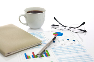 Business report with cup of coffee