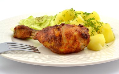 grilled chicken leg with potatoes and cucumber