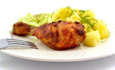 grilled chicken leg with potatoes and cucumber