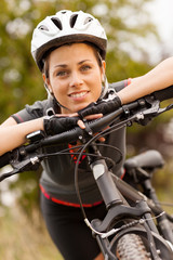 Portrait of woman with mountain bike