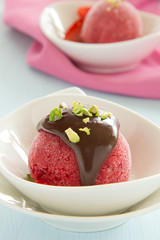 Strawberry sorbet with chocolate and pistachios.
