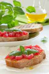 Fototapeta na wymiar Bruschetta with tomato, basil and olive oil.