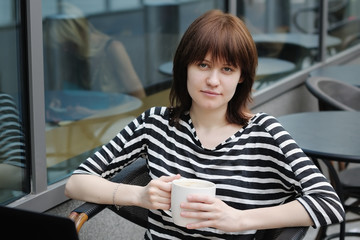 Girl in a outdoor cafe