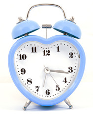 heart shaped blue alarm clock on white