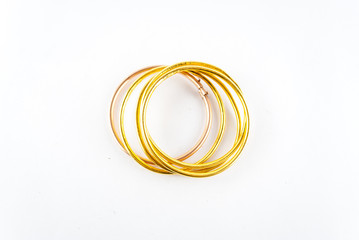 Fototapeta premium golden bracelets - bracelets isolated on the white background