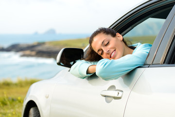 Woman in car on summer travel