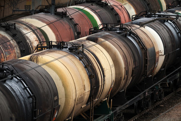 Railroad scene with trains of oil tanks