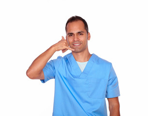 Fototapeta premium Charming male nurse gesturing call me with hand