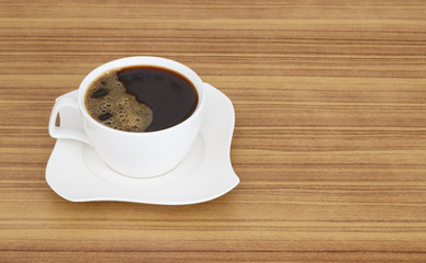 black coffee top view on wooden desk