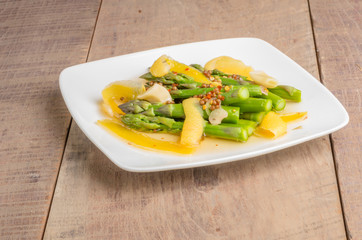 A plate of pickled asparagus on table